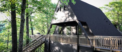 Private cabin featuring the classic A-Frame architecture with a sprawling deck.