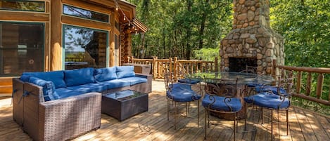 Large back deck with plenty of seating & views of Lake Hudson