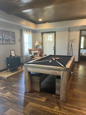 Pool / billiards table and indoor fire place on ground floor