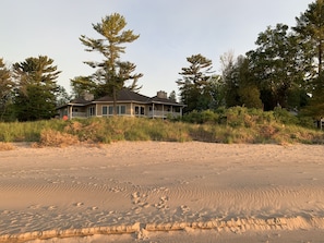 View of house standing on private beach, Summer 2022