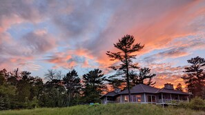 View of house at sunset standing on private beach
