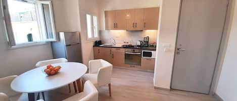 Large kitchen dining area with TV