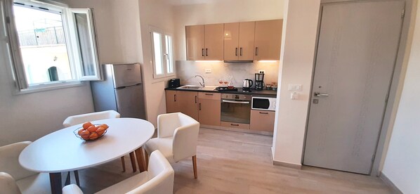 Large kitchen dining area with TV