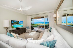 Living area with large flat screen television. 