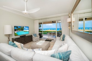 Living area with large flat screen television.