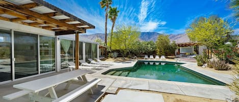 Large pool with mountain views