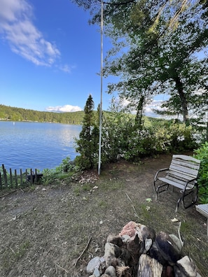 Lakeside fire-pit.  Dining table and chairs.