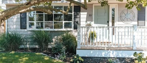 Cozy dead-end street with front porch and fences in back yard