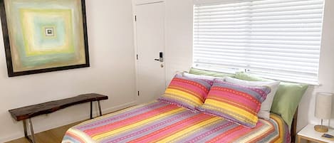 Lower level bedroom with queen bed.