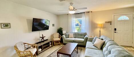 Comfortable living area. Brand new Smart TV w/ Bluetooth surround sound