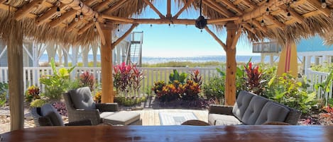 Enjoy the ocean view from inside the tiki bar or relax under the palapa!