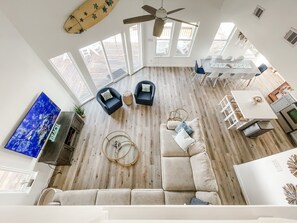 The upstairs hallway overlooks the living room, dining and kitchen.