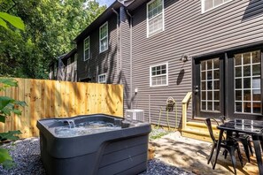 Our outdoor patio area is another highlight of the townhome - enjoy a morning coffee at the table or taking in the stars at night with a soak in the hot tub - we love this spot!