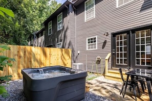 Our outdoor patio area is another highlight of the townhome - enjoy a morning coffee at the table or taking in the stars at night with a soak in the hot tub - we love this spot!