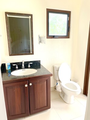 Bathroom with sink and toilet