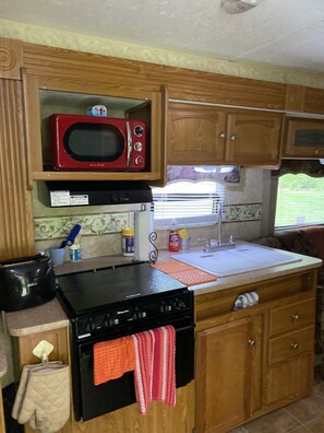 Kitchen with stove, microwave 