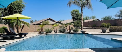 Your private pool oasis, featuring lounge chairs and ample seating. 
