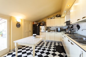 Kitchen room, fully equipped, oven, utensils, coffee maker, dishwasher, balcony