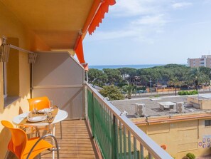 Sky, Cloud, Building, Wood, Outdoor Furniture, Shade, Yellow, Table, Chair, Condominium