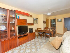 Furniture, Cabinetry, Wood, Home Appliance, Television, Living Room, Picture Frame, Lighting, Flooring, Interior Design