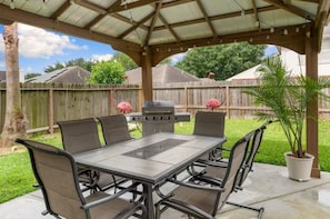 Enjoy dining in the shade of the gazebo and a grill