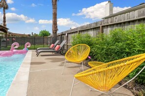 Sit and rest in our funky yellow chairs by the pool