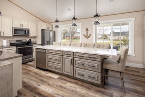 Kitchen with long island complete with dishwasher