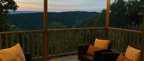 The covered porch is a favorite spot to take in the surrounding nature