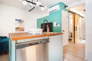 There is central HVAC, dimmable lighting in the living room and warm lighting over the island. There is a dishwasher as well.