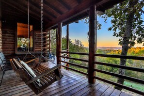 Back deck swing overlooking the lake.