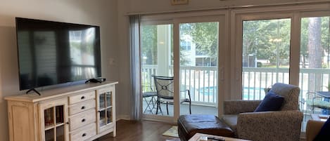 65" Smart TV is a man's delight. The pool view from the balcony is a lady's joy.