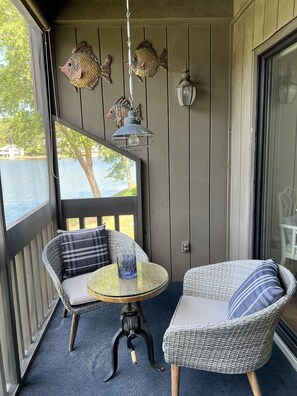 Screened in porch with pull down shades. 