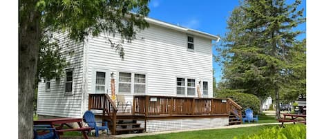 Cottage faces the center of the property, fire pit, playground, and gardens. 