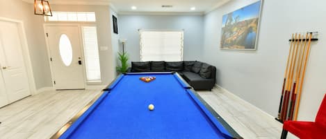 Pool table and entry way.