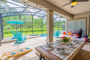 Enjoy our covered private lanai with gas grill, picnic table, lounging, & games