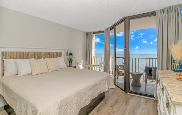 Exquisite bedroom with king bed and endless ocean views. 