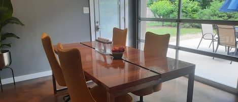 Dining room with glass door.  Inside dining with outside vibes.