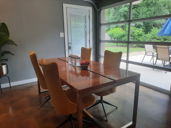 Dining room with glass door.  Inside dining with outside vibes.