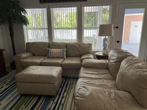 View of den from the kitchen.  Pool right outside the door