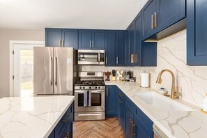 Large kitchen with waterfall island