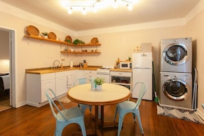 Fully stocked kitchen with washer and dryer