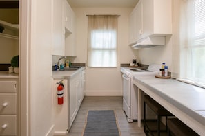 Cook up your favorite meals in our fully stocked kitchen, equipped with all the essentials you need for a seamless dining experience.