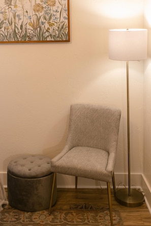 Cozy reading nook with elegant decor and soft lighting.