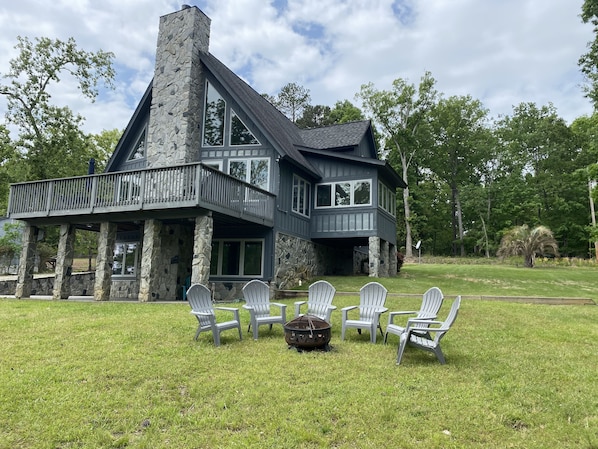 Lovely deck with grill and table up top. Patio below. Firepit onsite as well