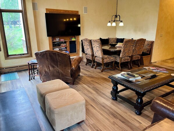 living room with new flooring - carpet has been removed 