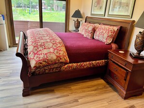 Master bedroom with doors to deck adn new flooring 