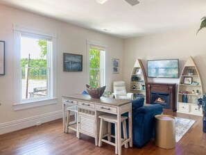 Family room with HDTV, Gas Fireplace, and river view.