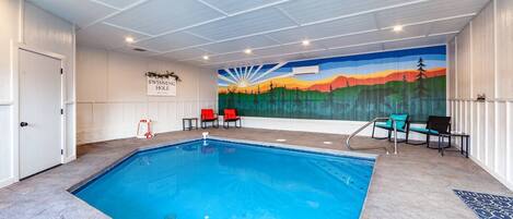 Heated indoor pool with custom smoky mountain mural