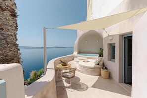 Patio with hot tub and outdoors seating area