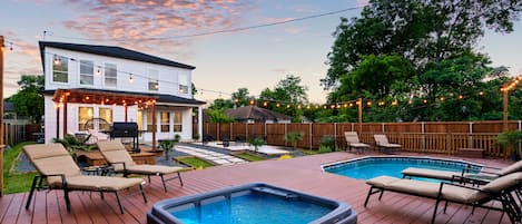 The stars of the backyard are the built-in deck pool and jacuzzi! 